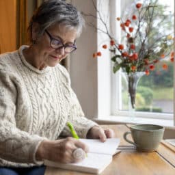 Senior woman writing in her journal