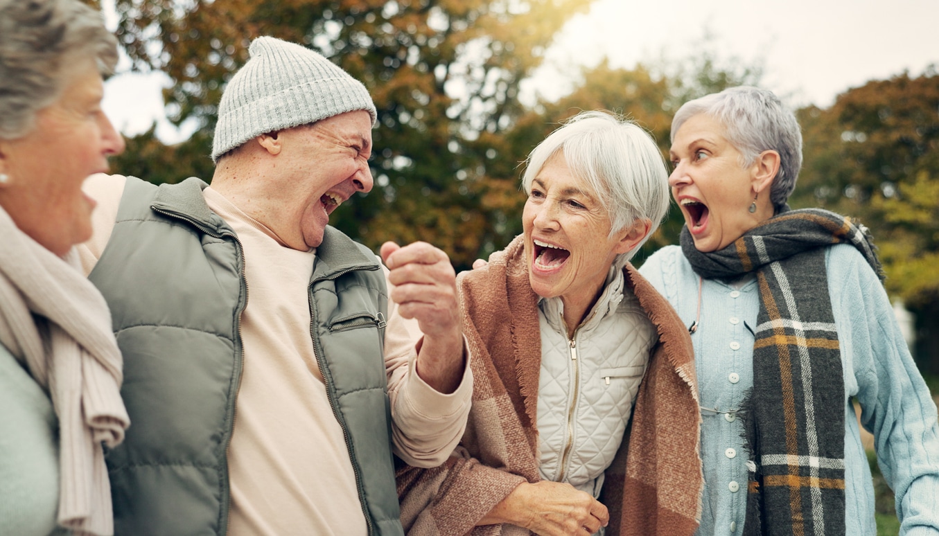 Senior friends laughing together.