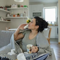 Woman Using Nasal Spray