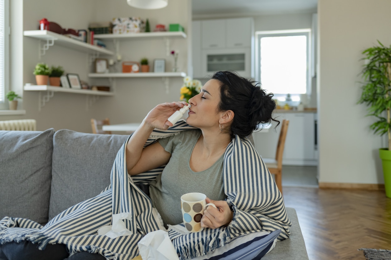 Woman Using Nasal Spray
