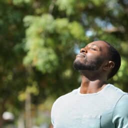 Man breathing fresh air on green park .jpg