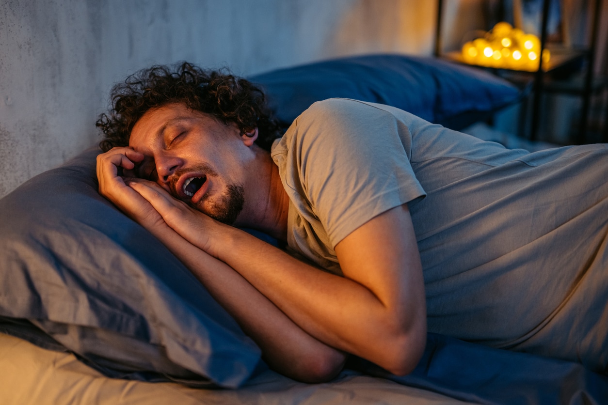 Mid-Adult Man Snoring In The Bed At Night